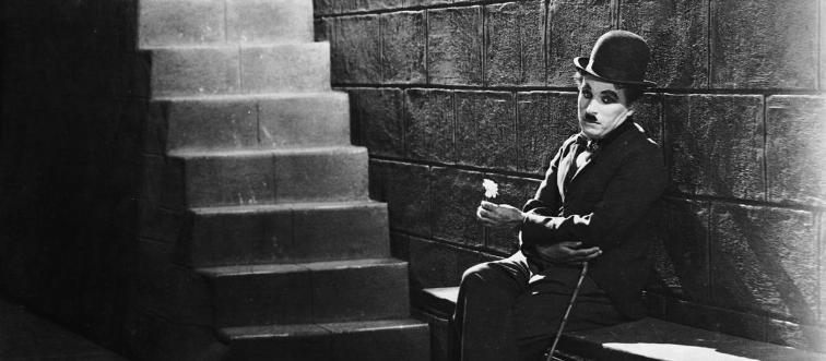Identify the silent film legend behind the iconic 'tramp' persona.
