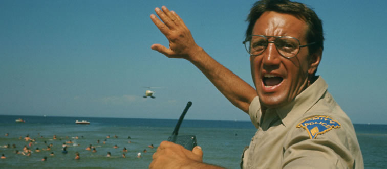 Which filmmaker unleashed the shark that changed summer blockbusters forever in Jaws (1975)?