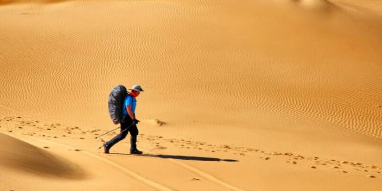 Beyond simple sunstroke, what lethal risk does the unrelenting desert sun drastically increase?