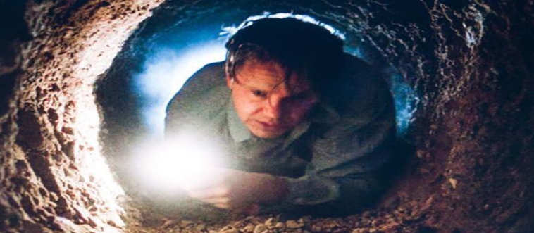 An inmate spends decades chipping away with a rock hammer just to indulge in a grueling, filth-laden crawl through a sewer pipe toward freedom.