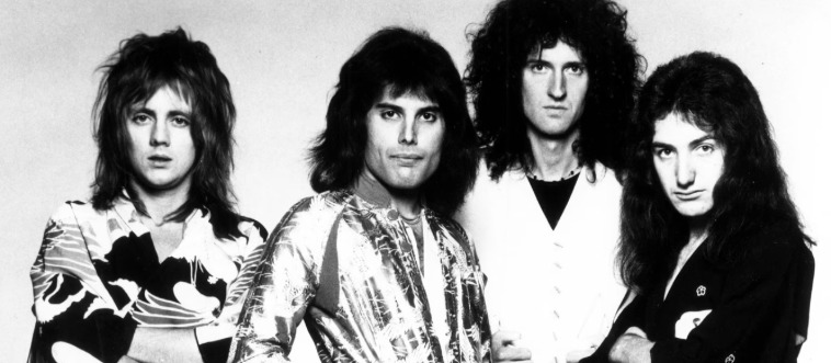 Which powerhouse rock ensemble was fronted by the incomparable Freddie Mercury?